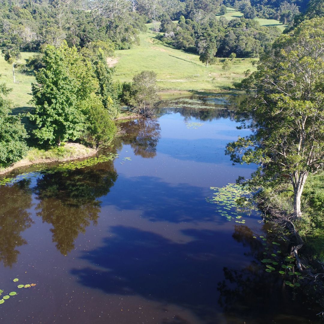 Aerial view of dam and farmland